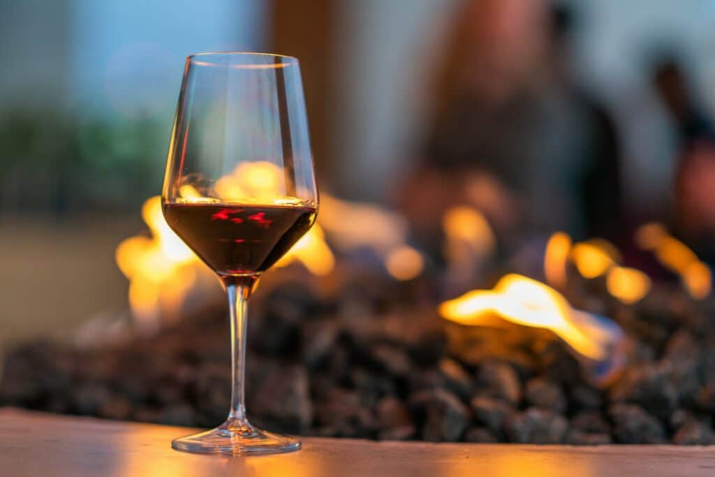 Glass of Red Wine and Fire Pit