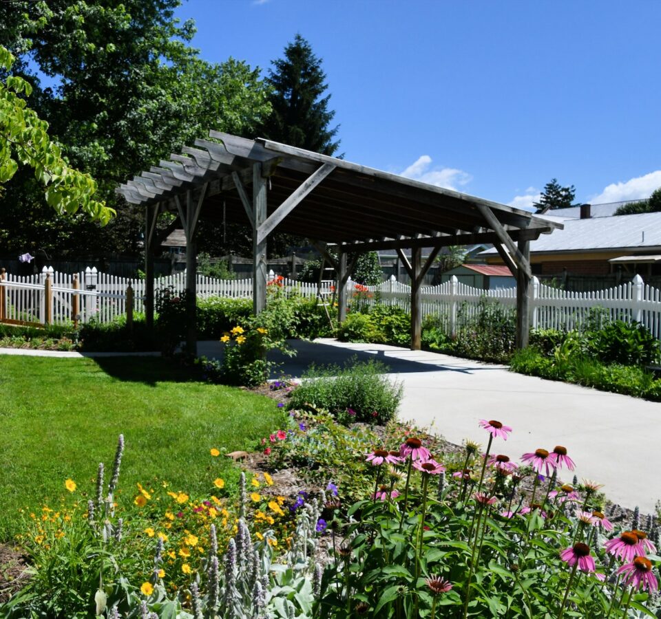 A landscaped carport patio in a typical middle class neighborhood