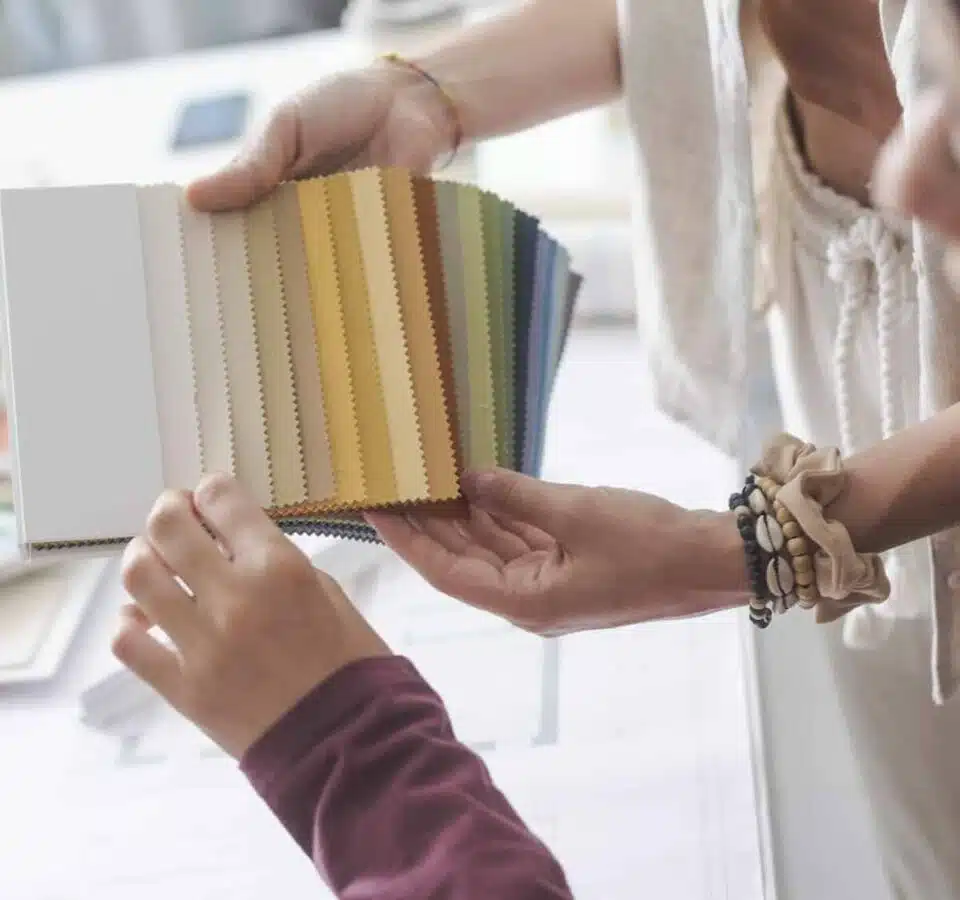 Interior designers checking fabric swatches Interior designers checking fabric swatches